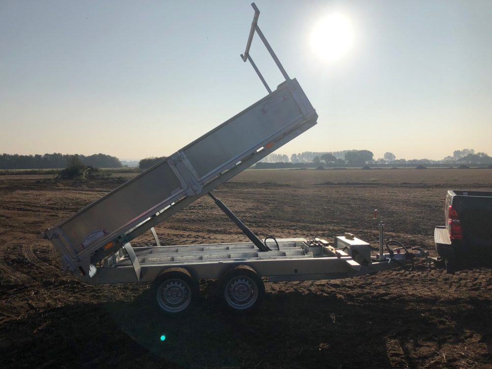 Tipping Trailer - tipped up with sun behind